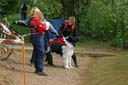Picture of landseer dog and owner stood on shore at test waiting to begin exercise 1